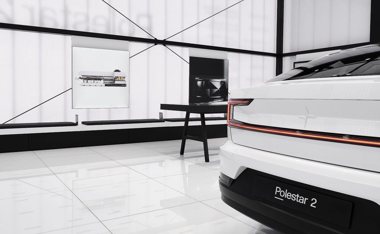 The back of a white Polestar 2 in a black and white room