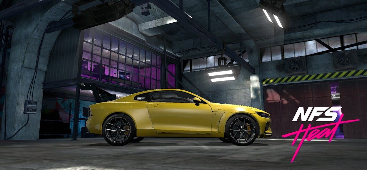 A yellow Polestar in a concrete garage with the NFS Heat logo