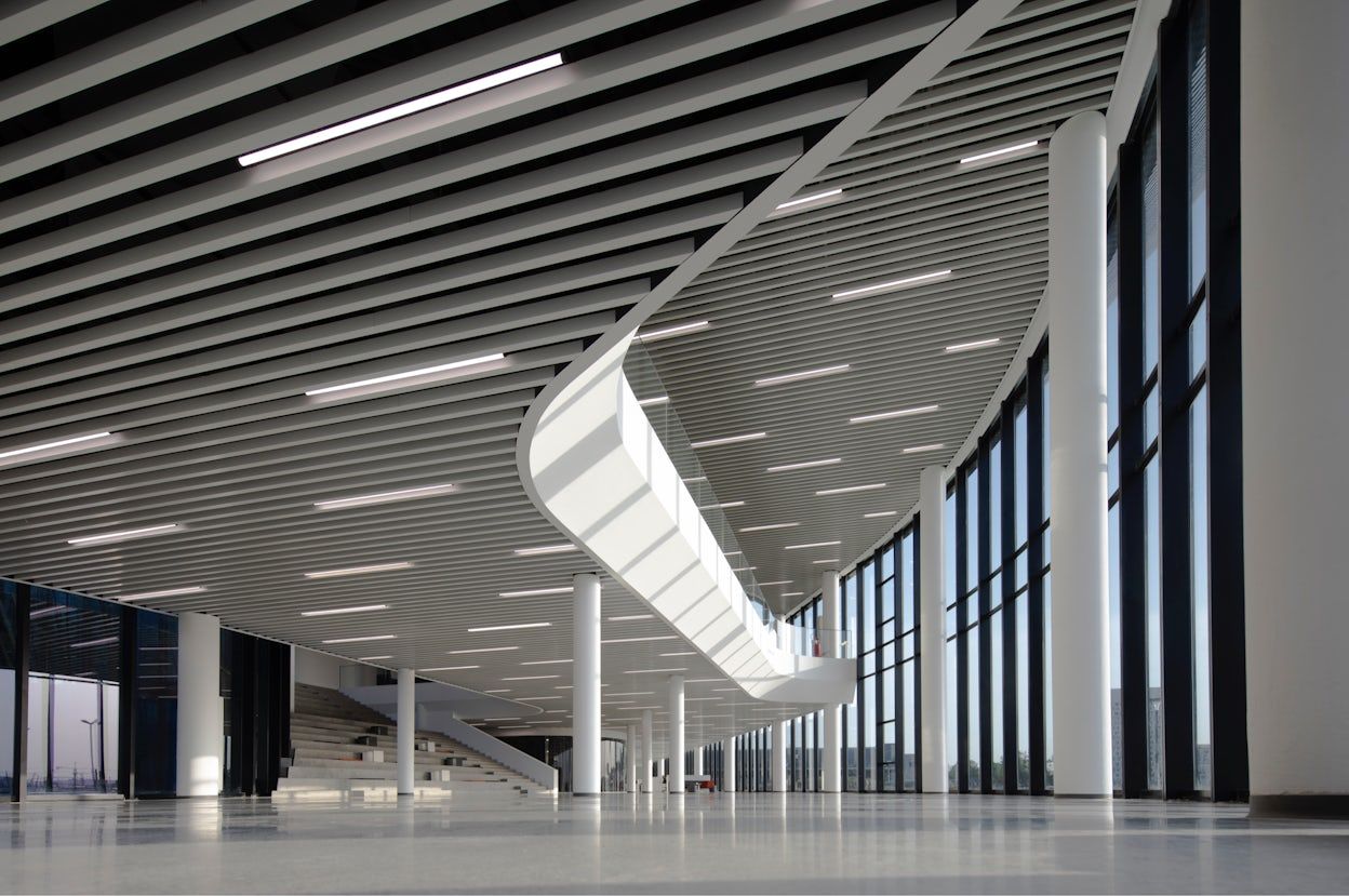 White pillars and large windows inside of the Polestar Production Centre in Chengdu, China