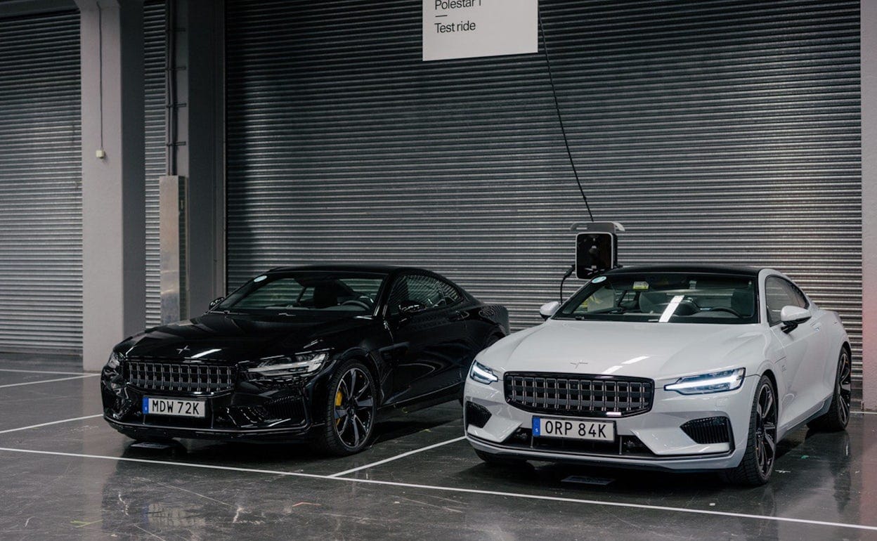 Two Polestar 1 cars parked by a Test ride sign at Ecar expo 2019.
