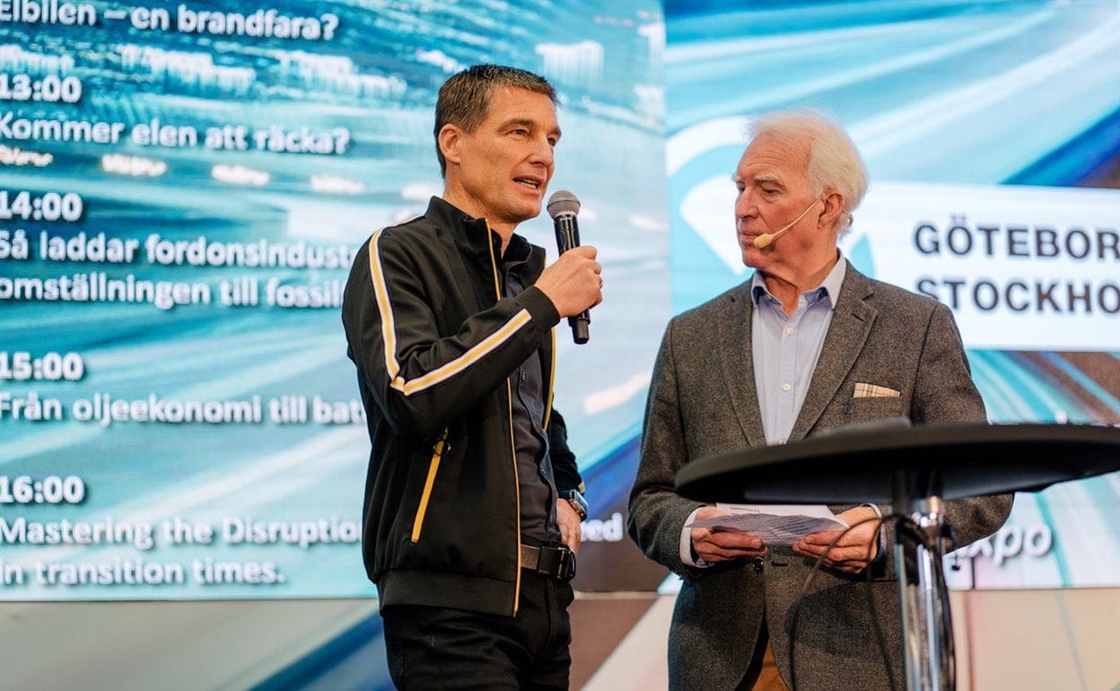 Two people on stage at Ecar expo 2019