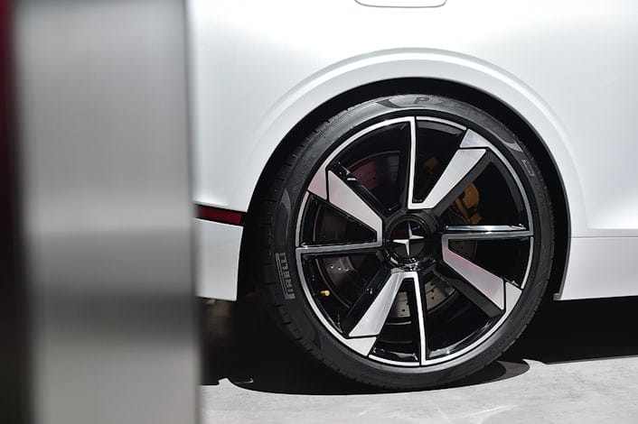 A close-up of a wheel on a white Polestar