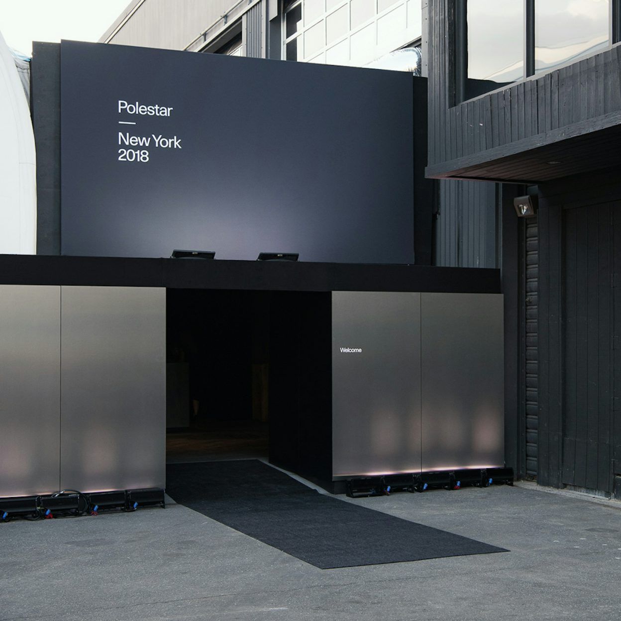 The entrance to a building with a sign that reads Polestar New York 2018