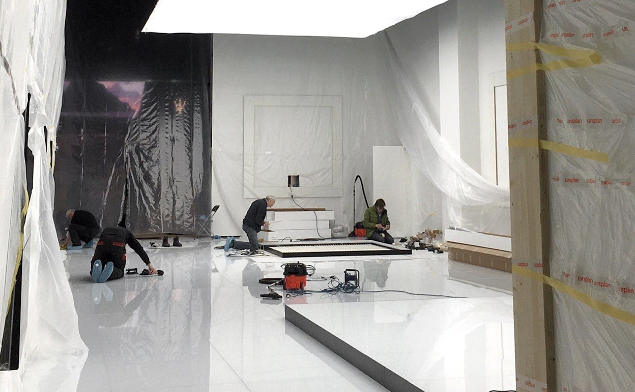A white metal-panelled space under construction