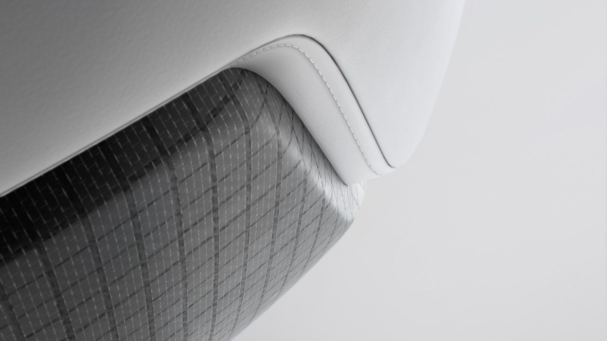 A close-up of a Polestar seat in grey and white