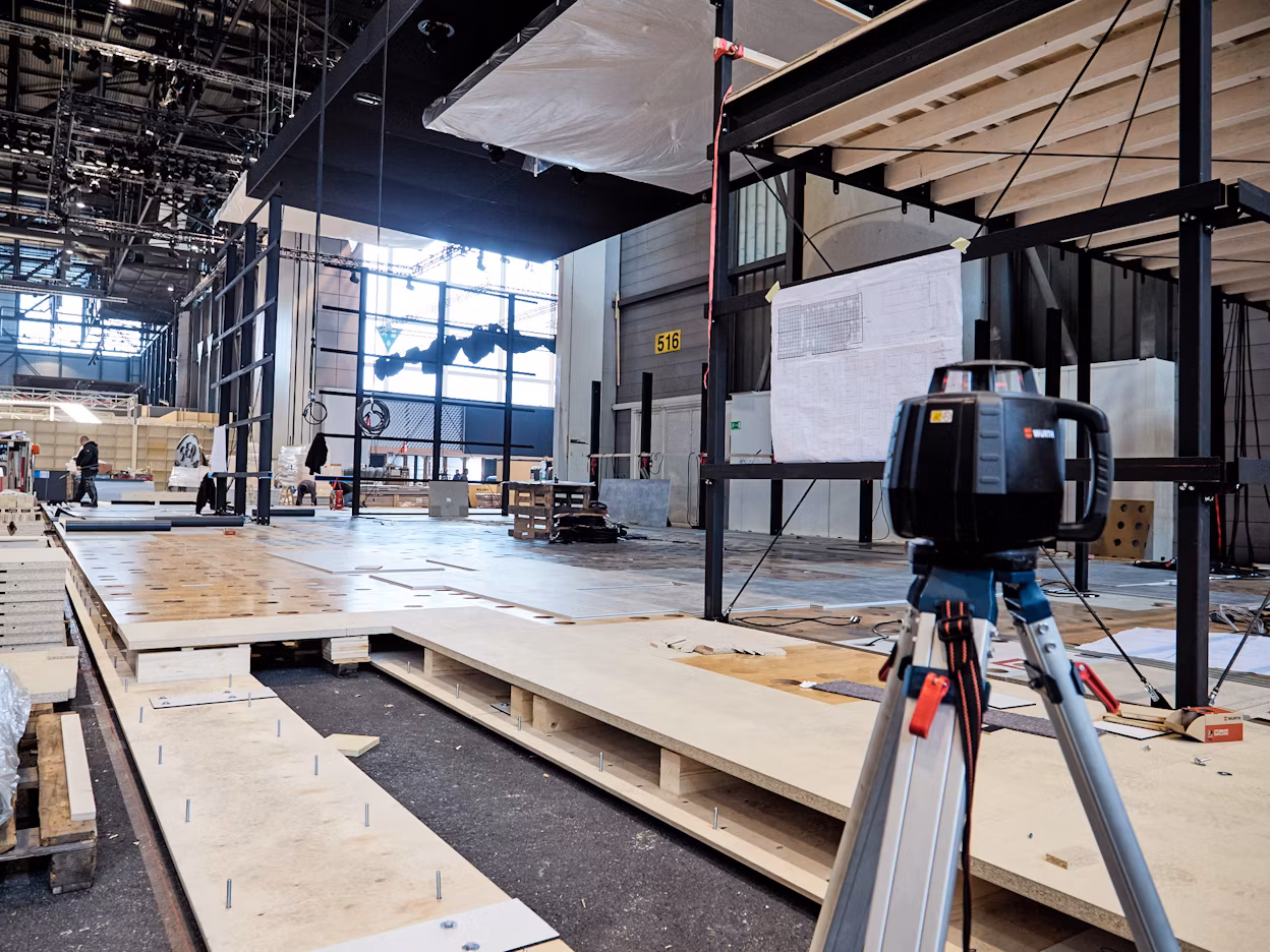 A stand being assembled at the Geneva International Motor Show 2018.