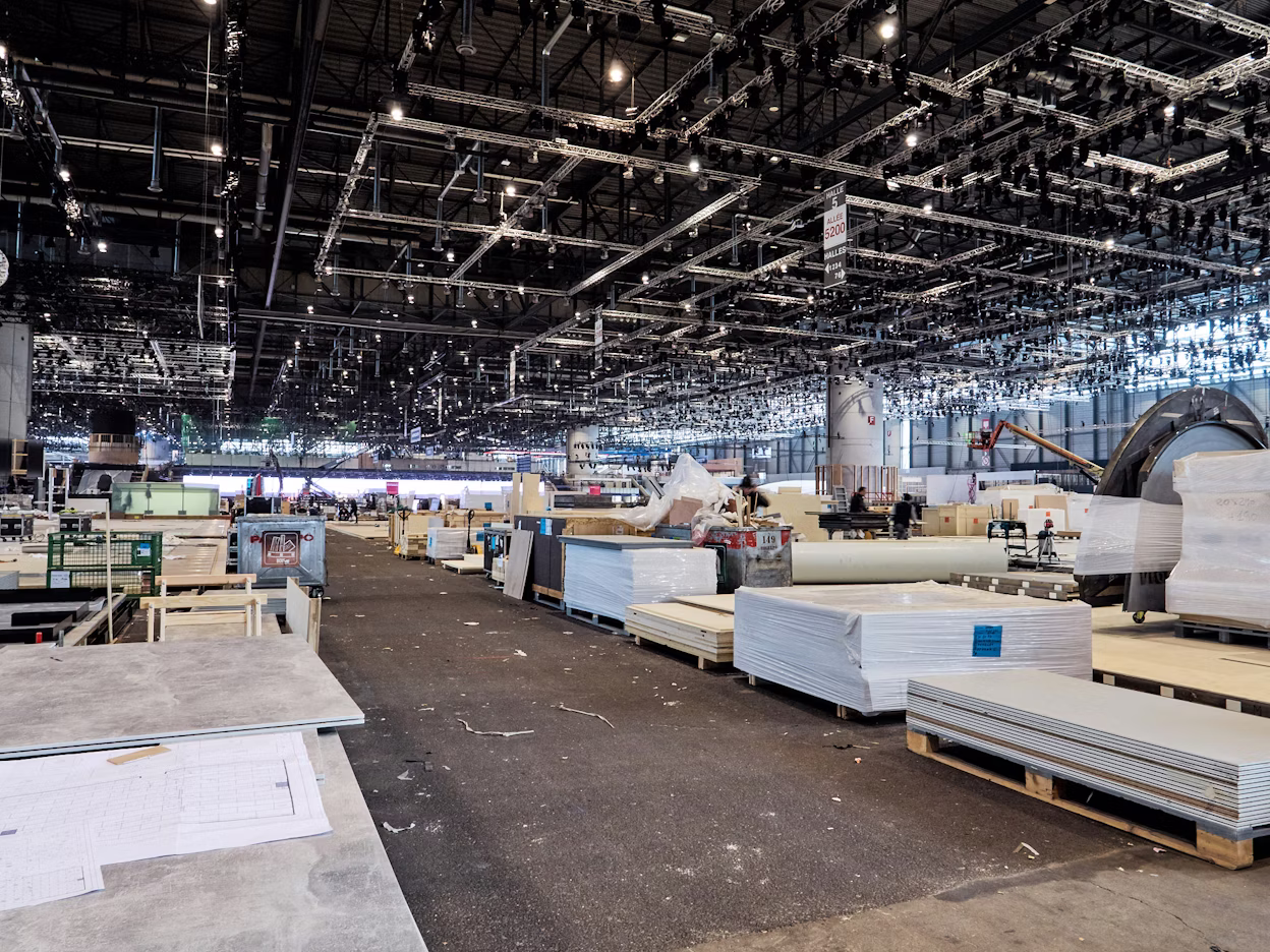 A large warehouse with piles of building materials.