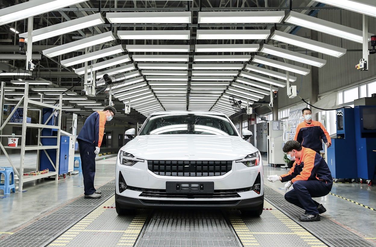 A white Polestar 2 on the production floor at Luqiao production facility.