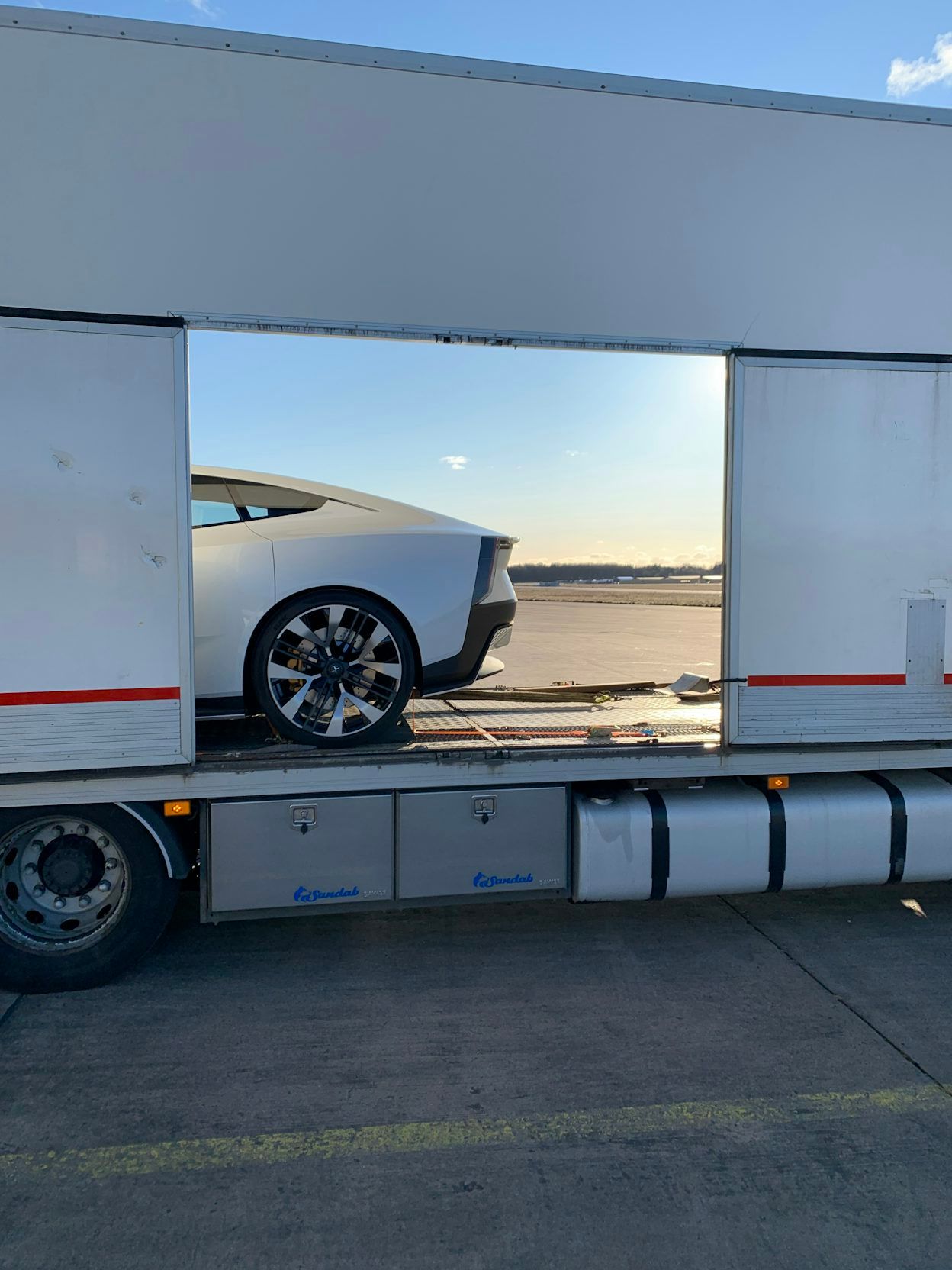 The rear of a Polestar visible on a truck