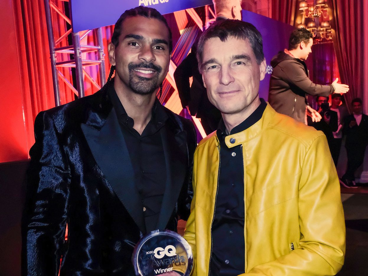 Thomas Ingenlath photographed with another person and holding the 2020 GQ Car Award