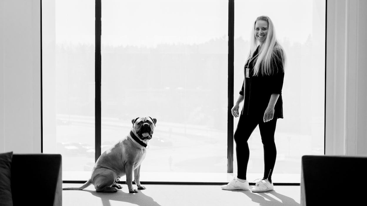 Sofie Dunert and her dog Kiwi photographed in black and white.