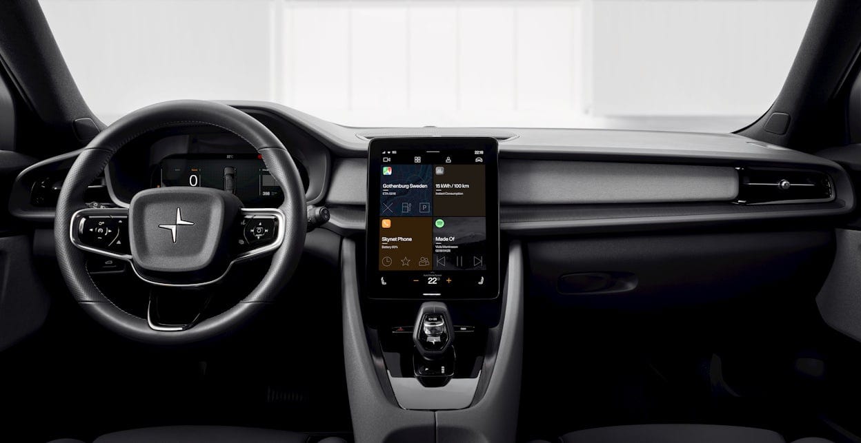 Close-up of the steering wheel and interface in a Polestar with black interior.