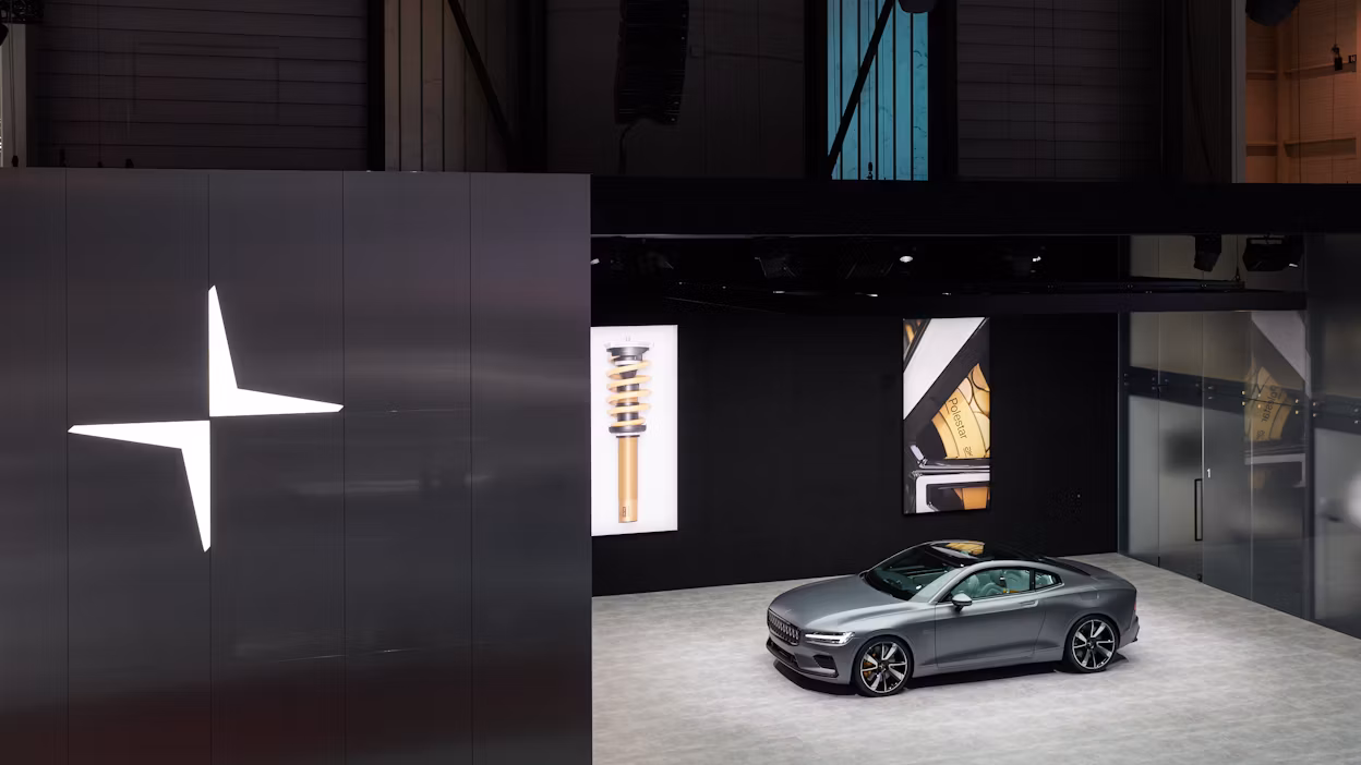 Brid's-eye view of a grey Polestar 1 in the Polestar stand at the Geneva International Motor Show 2018.
