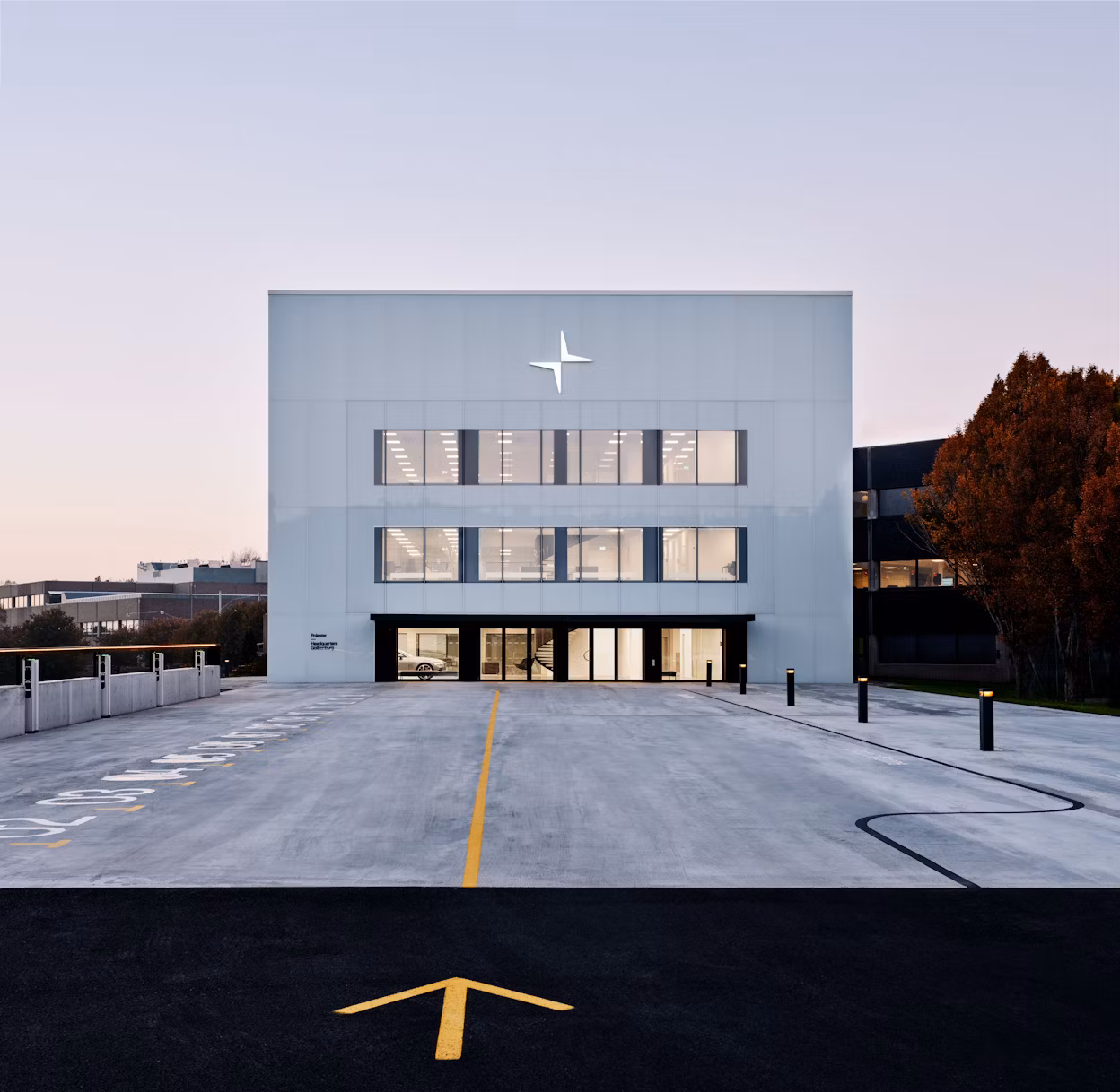 The Cube, a minimalistic office building with the Polestar logo.