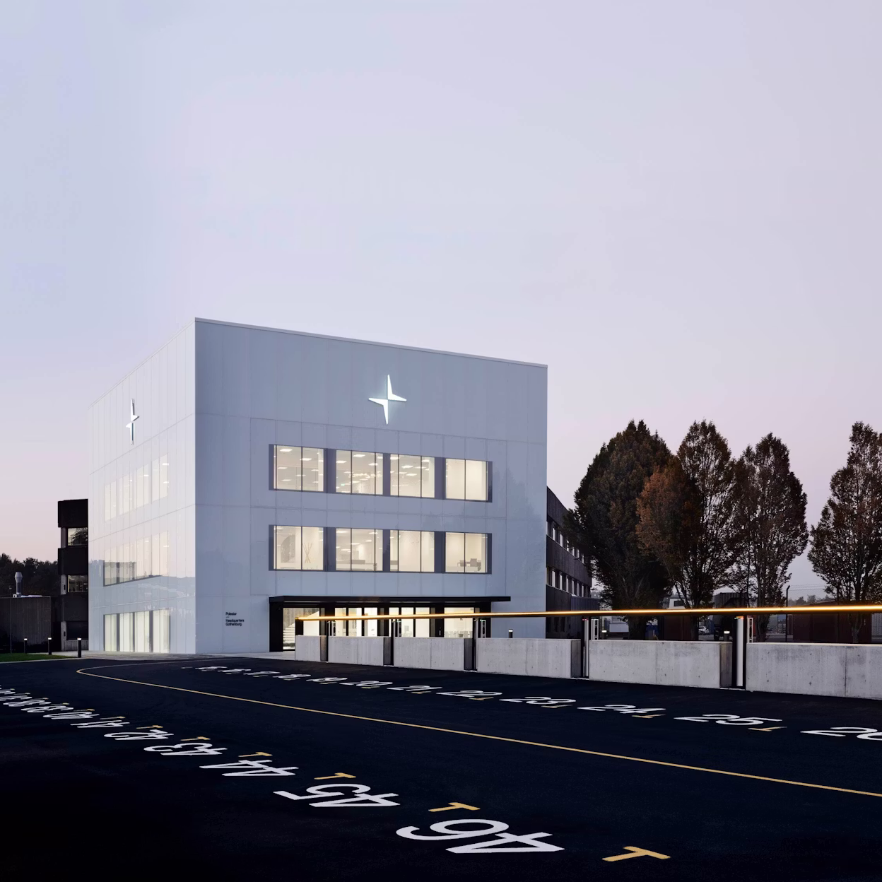 The Cube, a minimalistic office building with the Polestar logo.