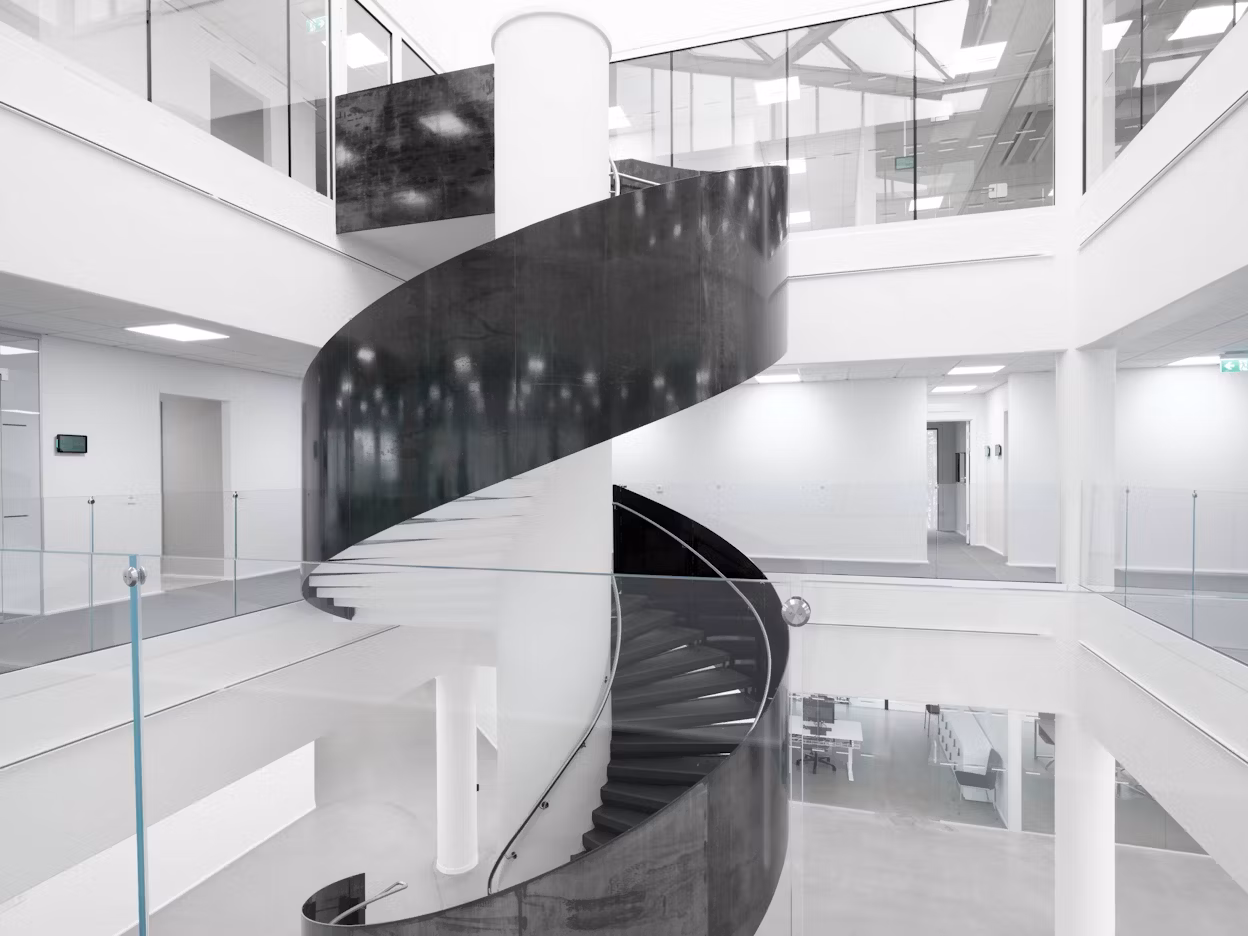 A spiral staircase inside The Cube building.