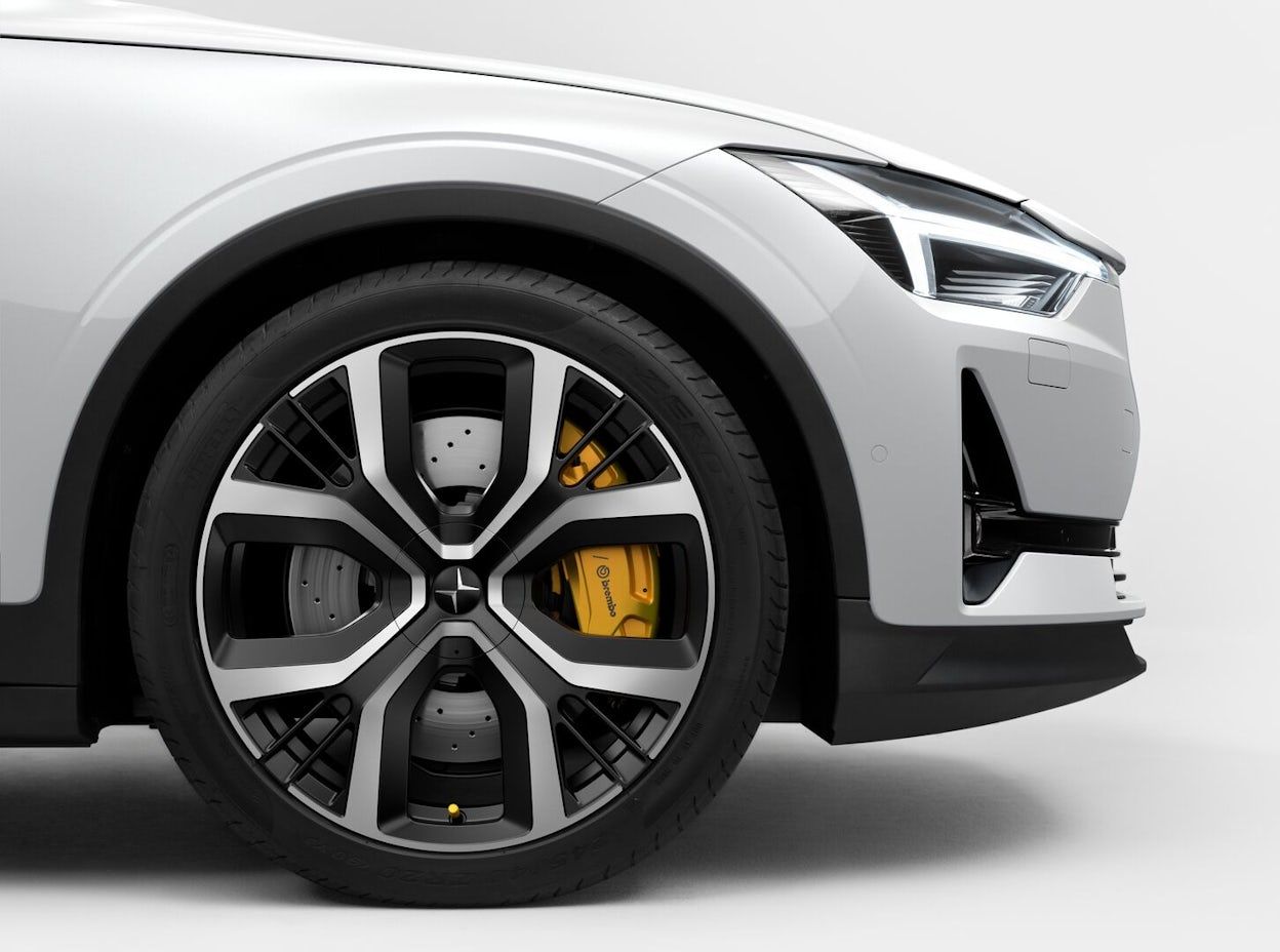 Side view of the wheels and rims of a white Polestar 2.