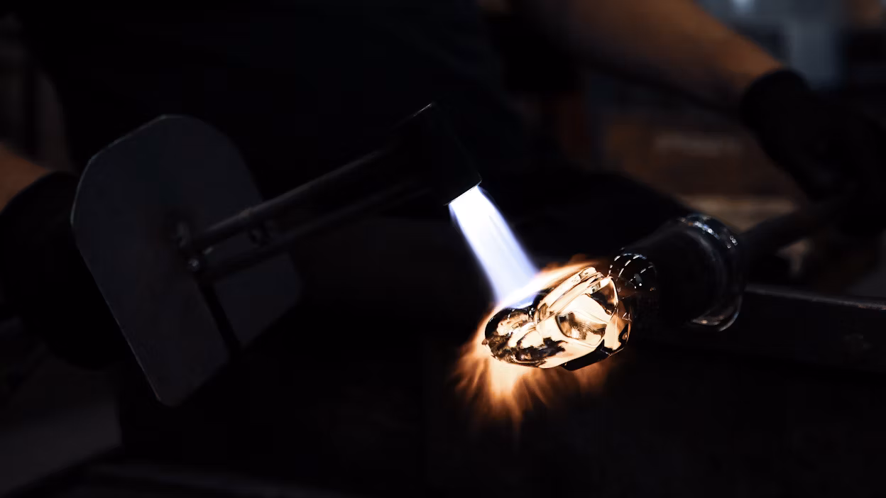 Glass artisans making gearshift out of lead-free crystal.