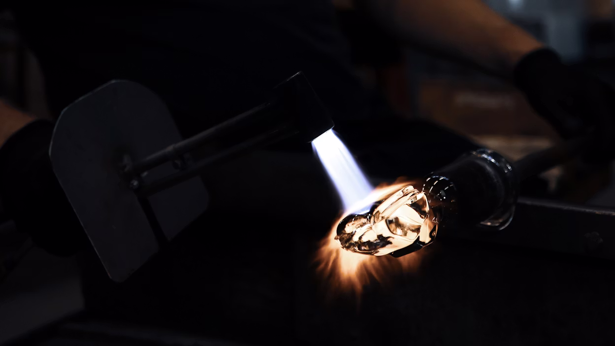 Glass artisans making gearshift out of lead-free crystal.