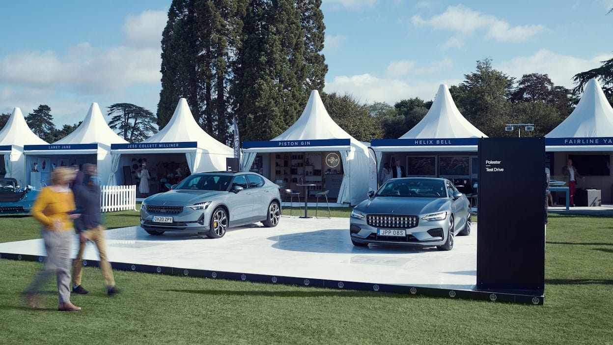 The Polestar event stand at the 2020 Salon Privé in front of a row of white tents.