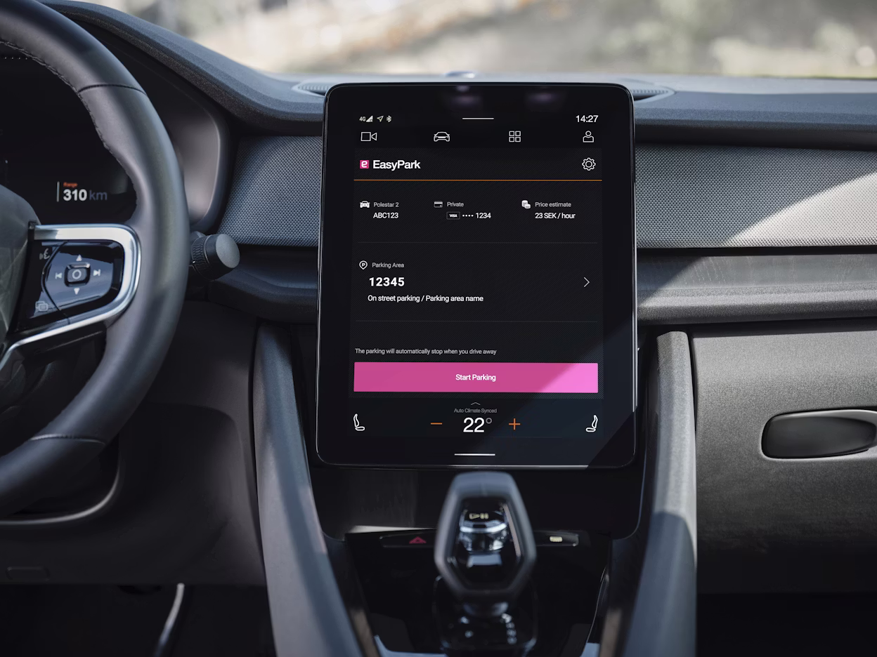 Dashboard of a Polestar car displaying EasyPark app on a central touchscreen with parking and climate control options.