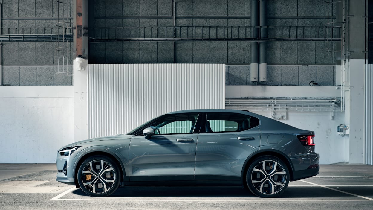 Side view of a grey Polestar 2 parked in a garage.
