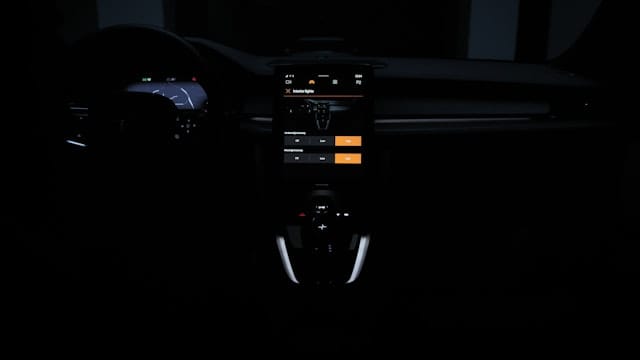 Overview of front panel in Polestar 2 in dark mode where lights are shown 