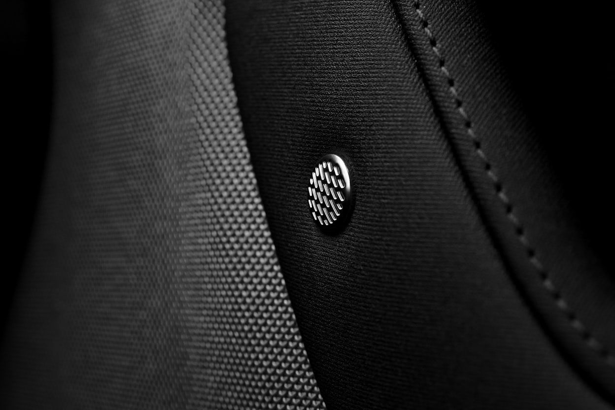 Close-up of the Harman Kardon car seat button.