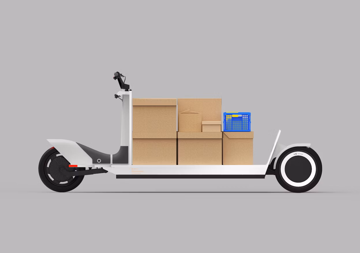 Cardboard boxes in different sizes placed on an elongated white electric bike.