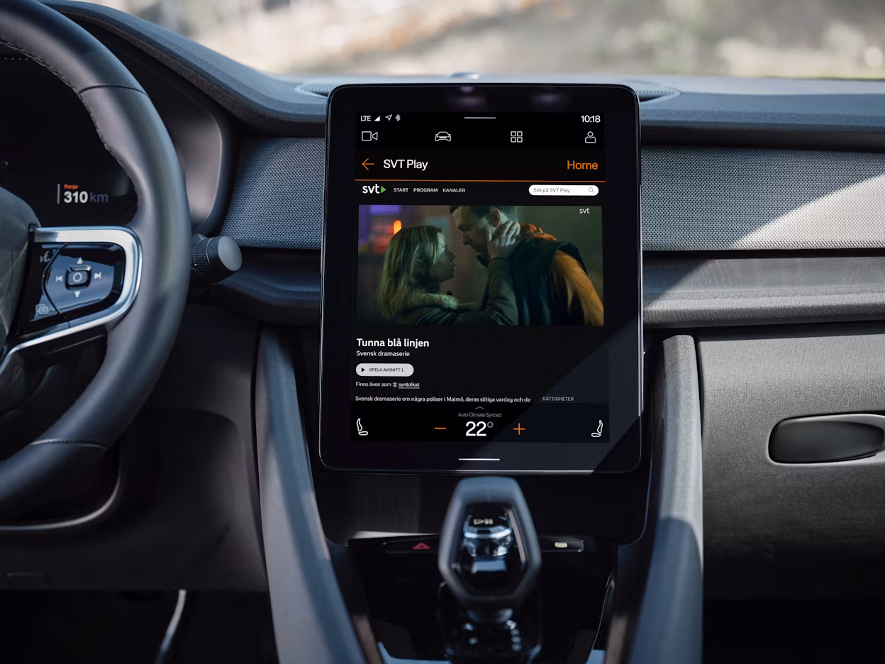 In-car display in a Polestar car showing a thumbnail from the SVT series Tunna blå linjen.