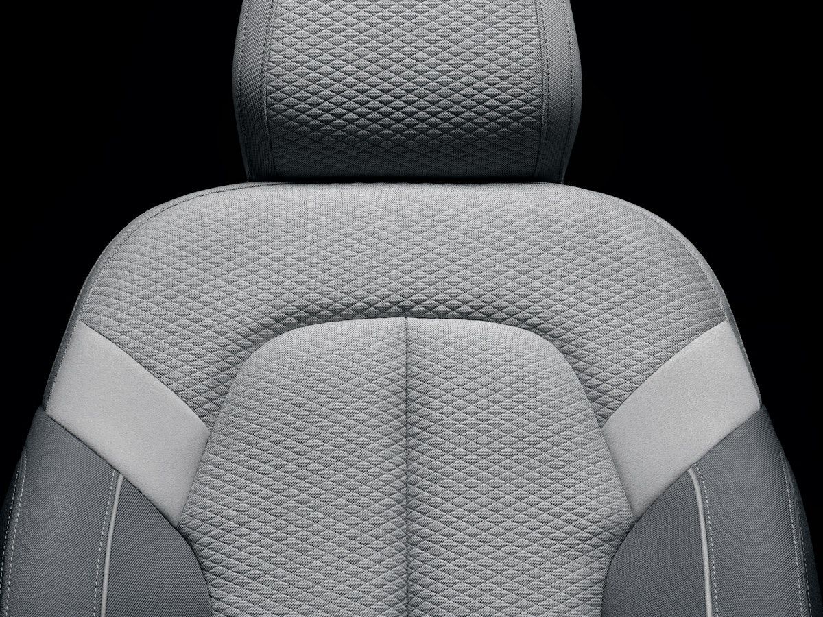 Detailed view of grey car seat.
