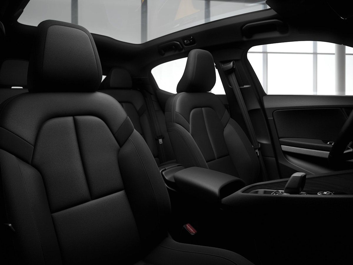 Front view of black car seats in the front of Polestar 2
