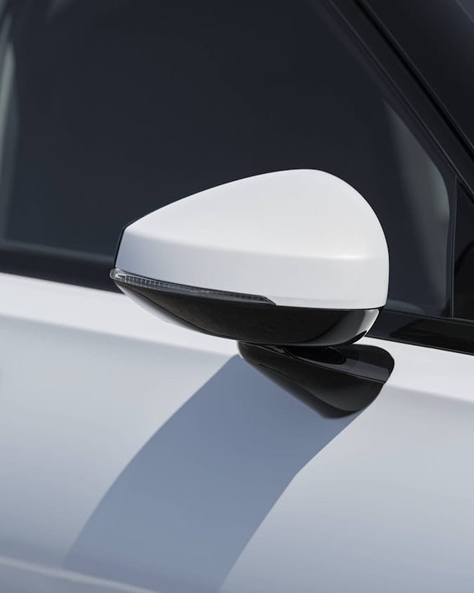 Exterior side mirror of white Polestar 2 from the front side