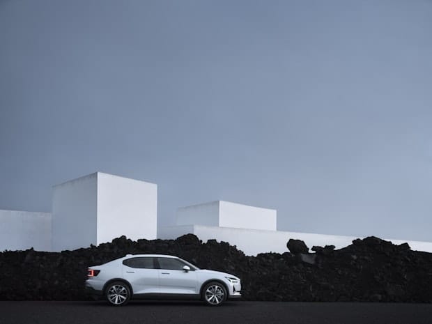 A white Polestar 2 car parked on the side of the road