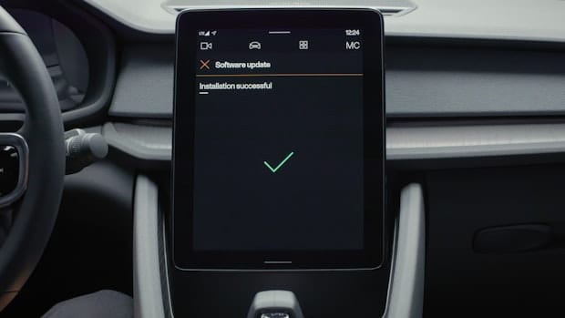 In-car display showing an green checkbox for installation success