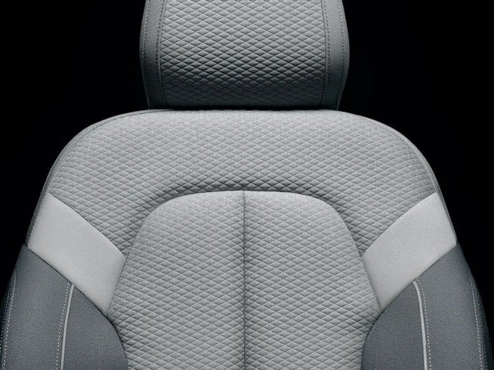A grey passenger seat in upholstery fabric.
