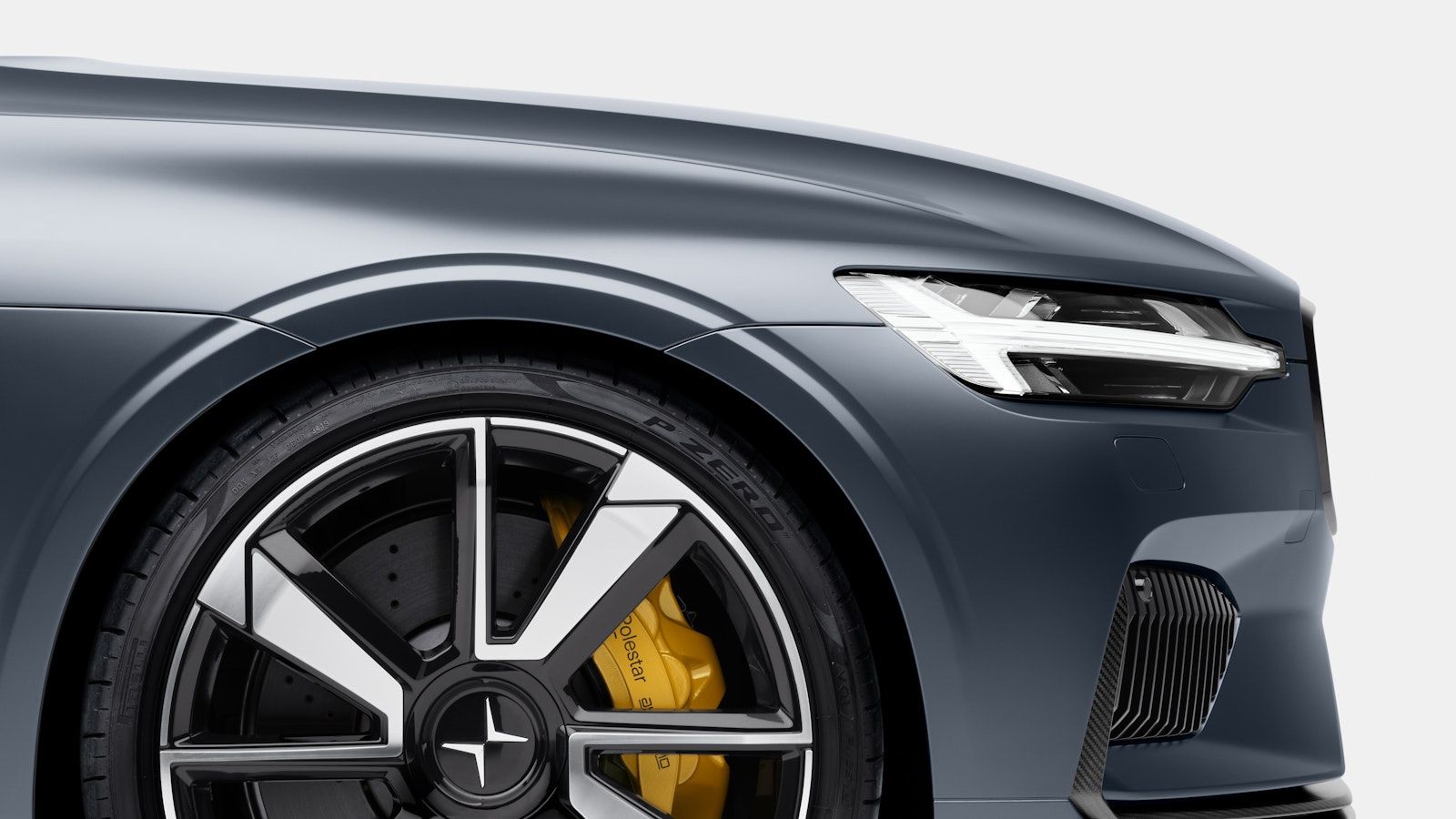 The wheels, rims and front disc brakes on a blue Polestar 1