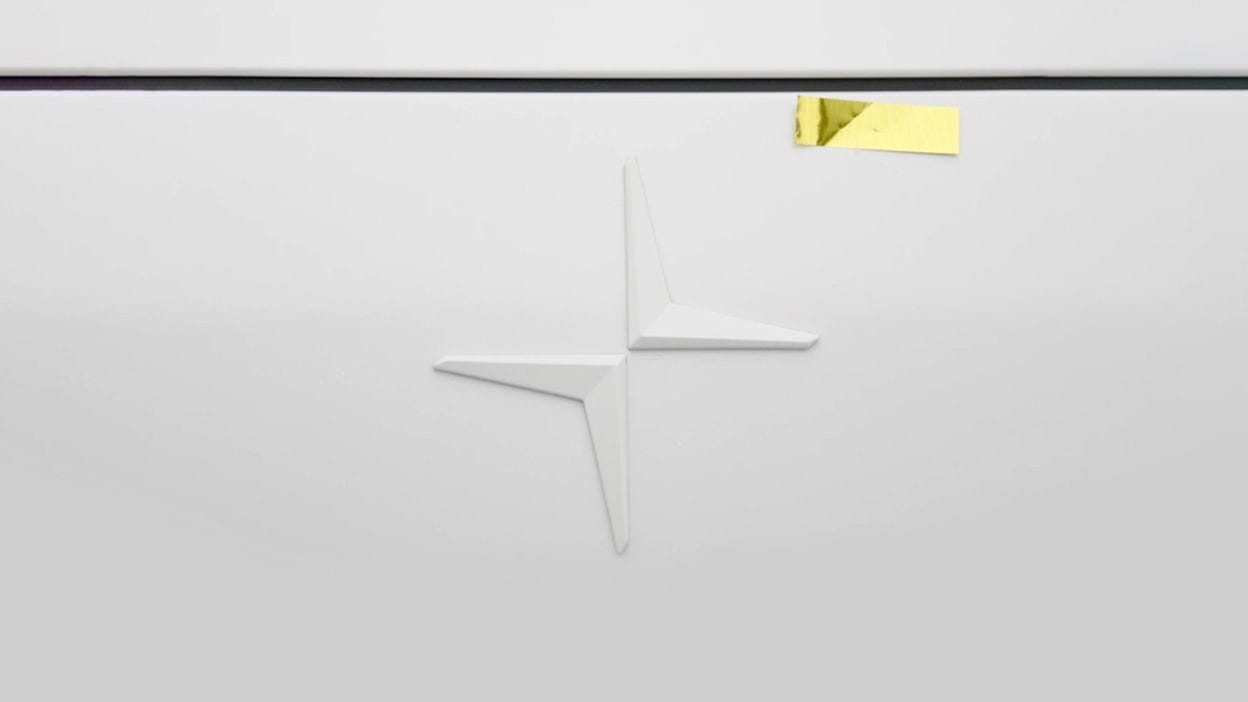 Close-up of a Polestar logo with a golden piece of tape placed on top