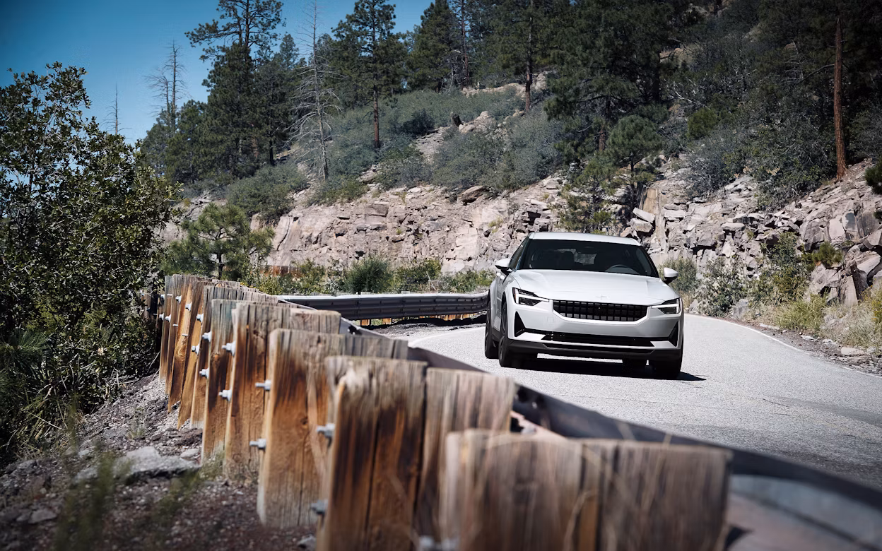 Front view of a white Polestar 2 on the road in New Mexico.