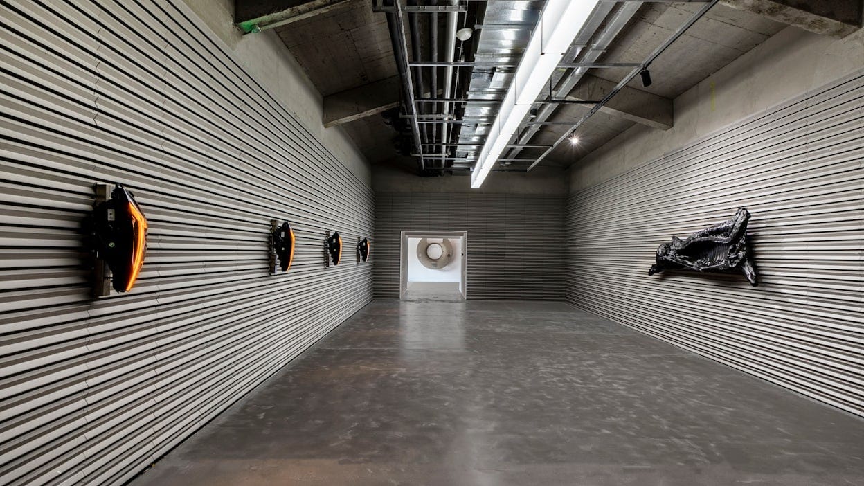 Art pieces 'foreign objects' displayed in a grey industrial space