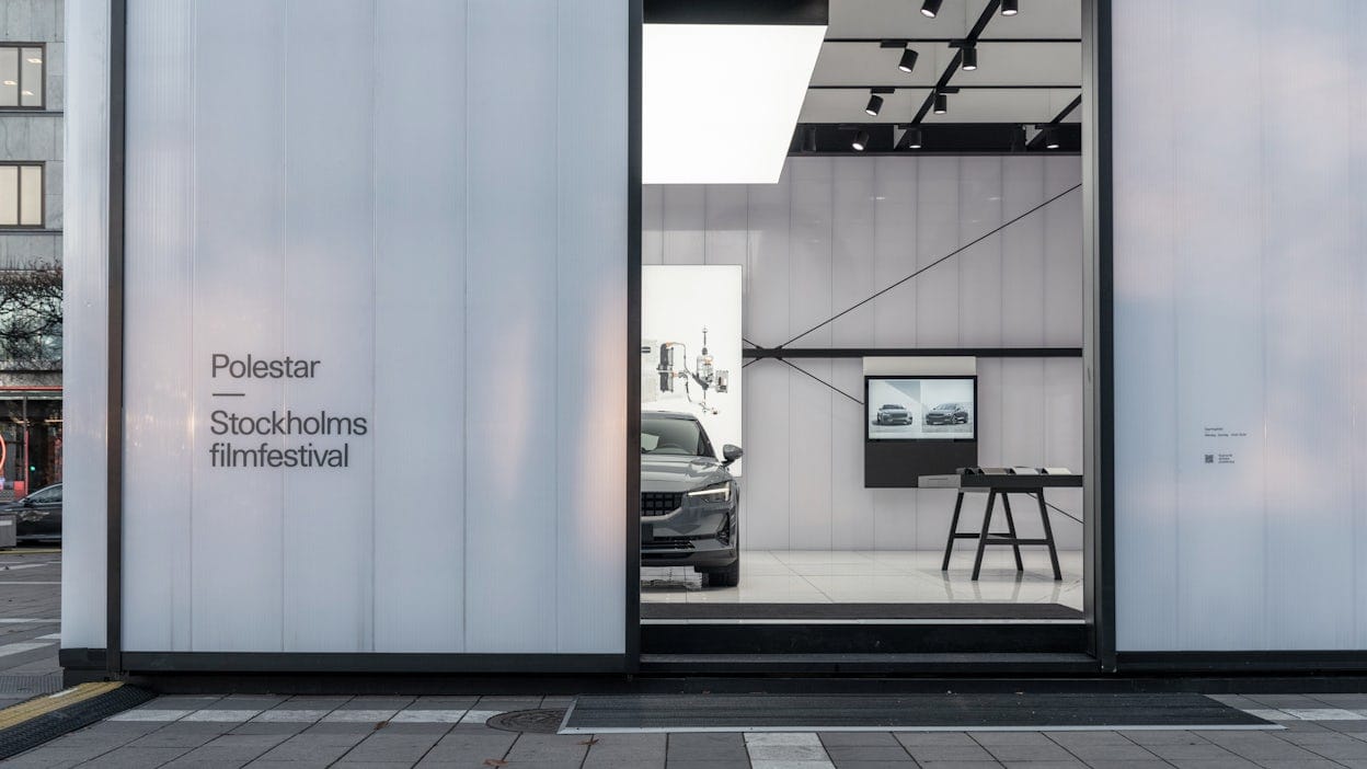 A glimpse inside the Polestar cube in Norrmalmstorg showing a Polestar.