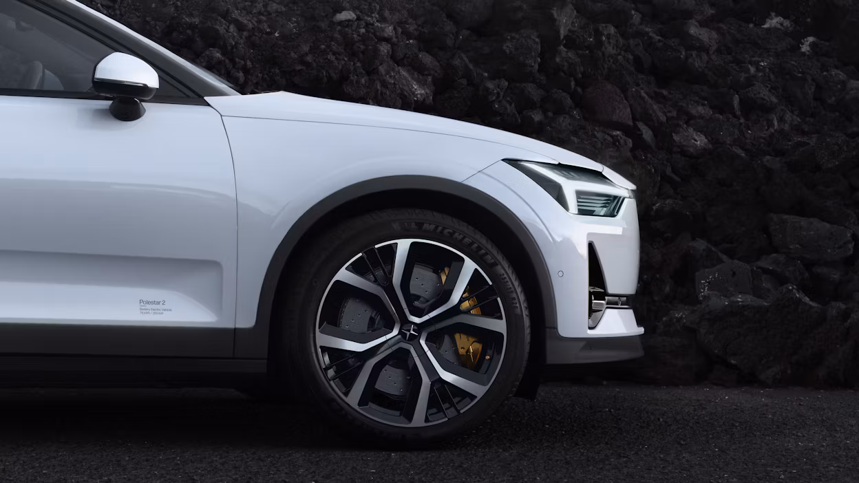 Side view of the front of a white Polestar 2.