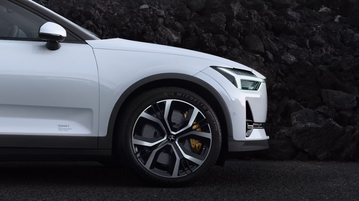 Side view of the front of a white Polestar 2.