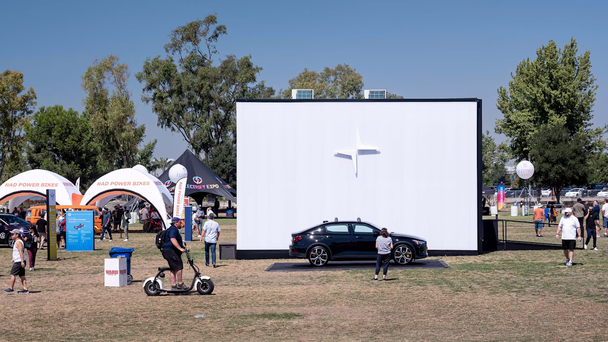 Black Polestar 2 displayed at an outdoor arena of the Electrify Expo 2021.