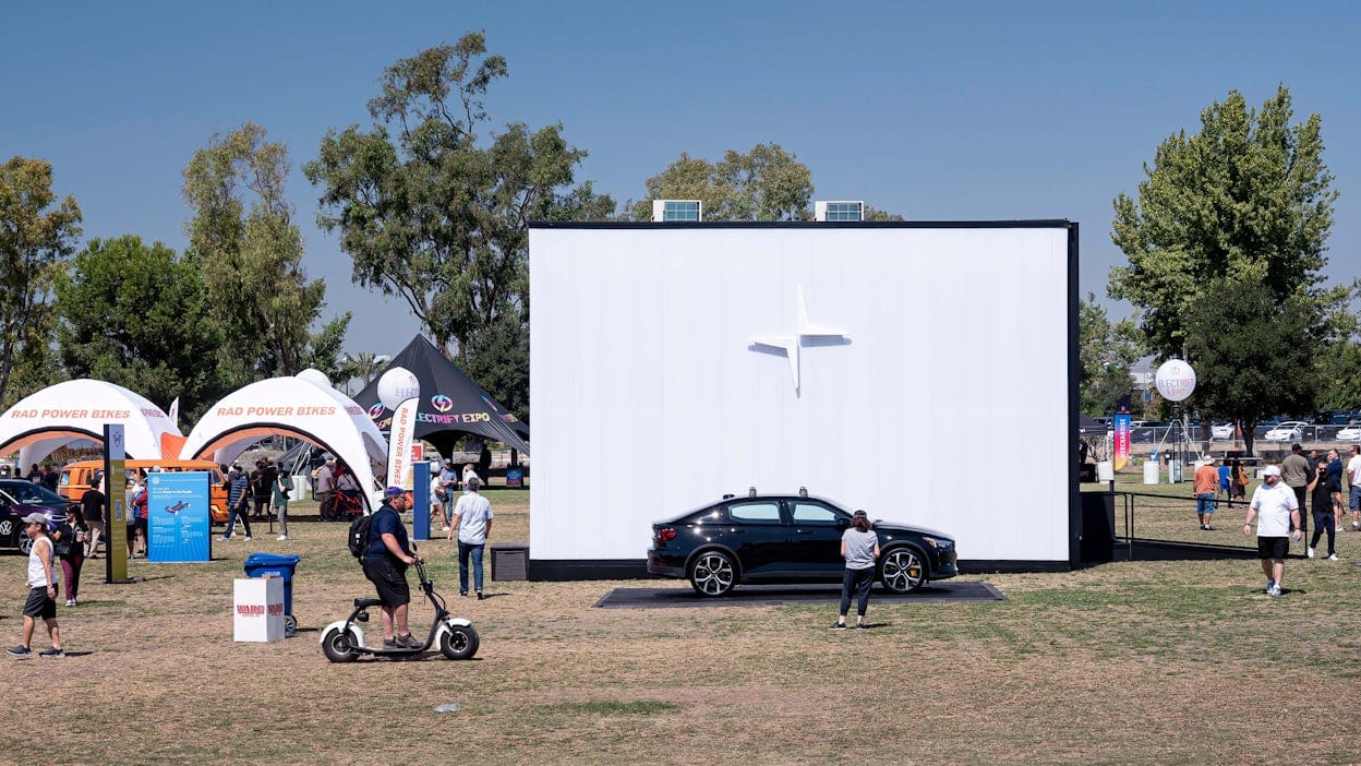 Black Polestar 2 displayed at an outdoor arena of the Electrify Expo 2021.