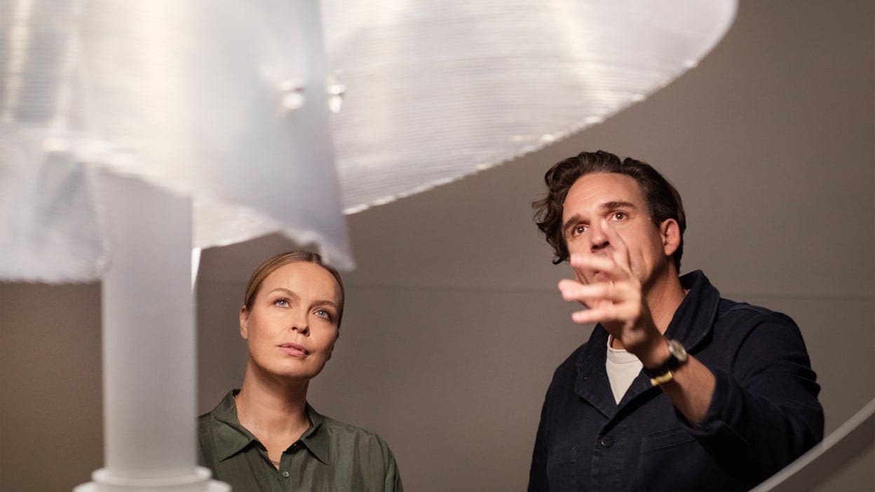 Fredrika Klarén and Thijs Biersteker inspecting an art piece.