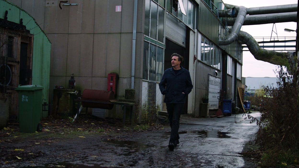 Thijs Biersteker walking outside his warehouse in Zaandam.