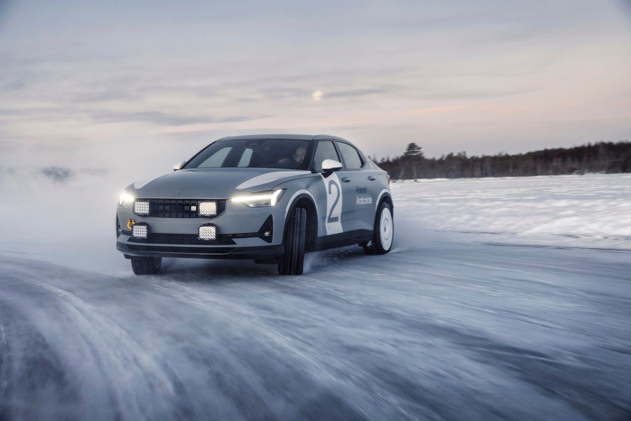 Grey Polestar 2 in a snowy and windy setting at the Arctic Circle