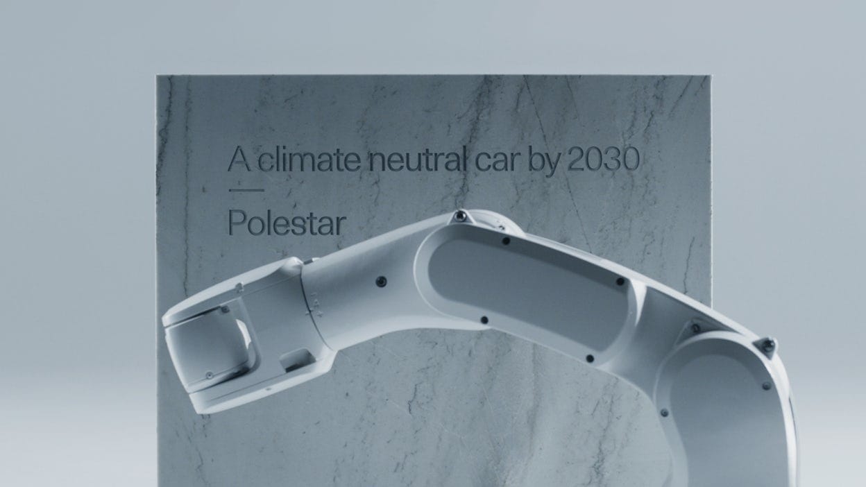 AI-robot engraves marble stone with text saying A climate neutral car by 2030