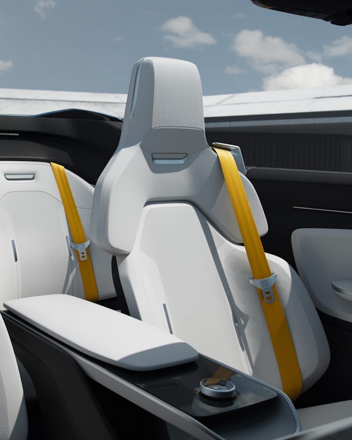 Light car seats inside Polestar o2 with golden seat belts